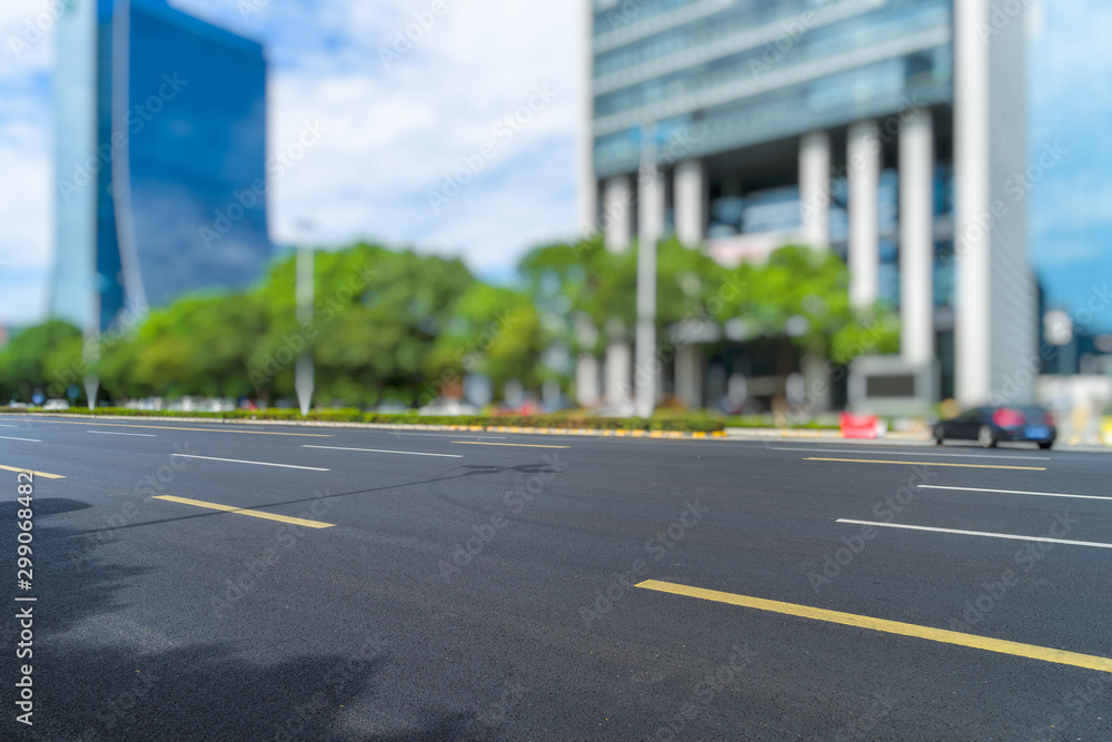 Obraz premium empty road and modern office buildings.