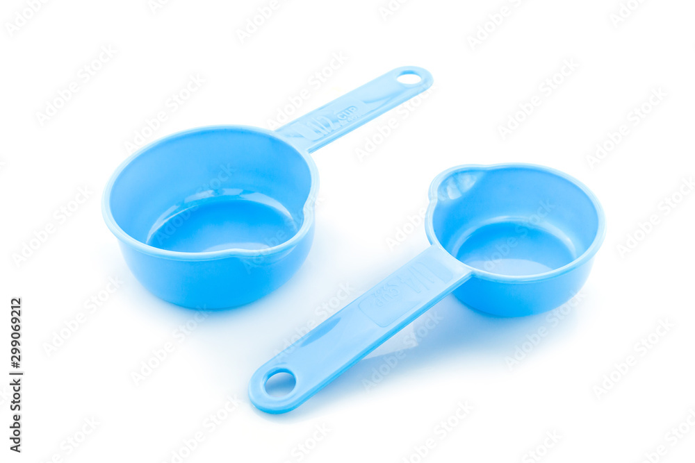 a set of measuring spoon of plastic on white background. a set of measuring spoon of plastic on white background.
