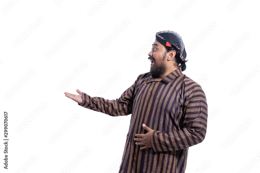 asian man with javanese traditional cloth lurik presenting to copyspace isolated asian man with javanese traditional cloth lurik presenting to copyspace isolated