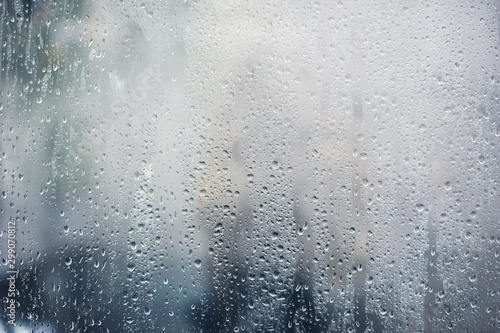Fototapeta Rainy background, rain drops on the window, autumn season backdrop, abstract tex