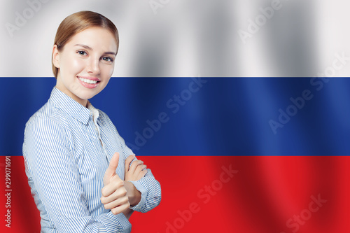 Russia concept with happy cute woman student with thumb up on th photo