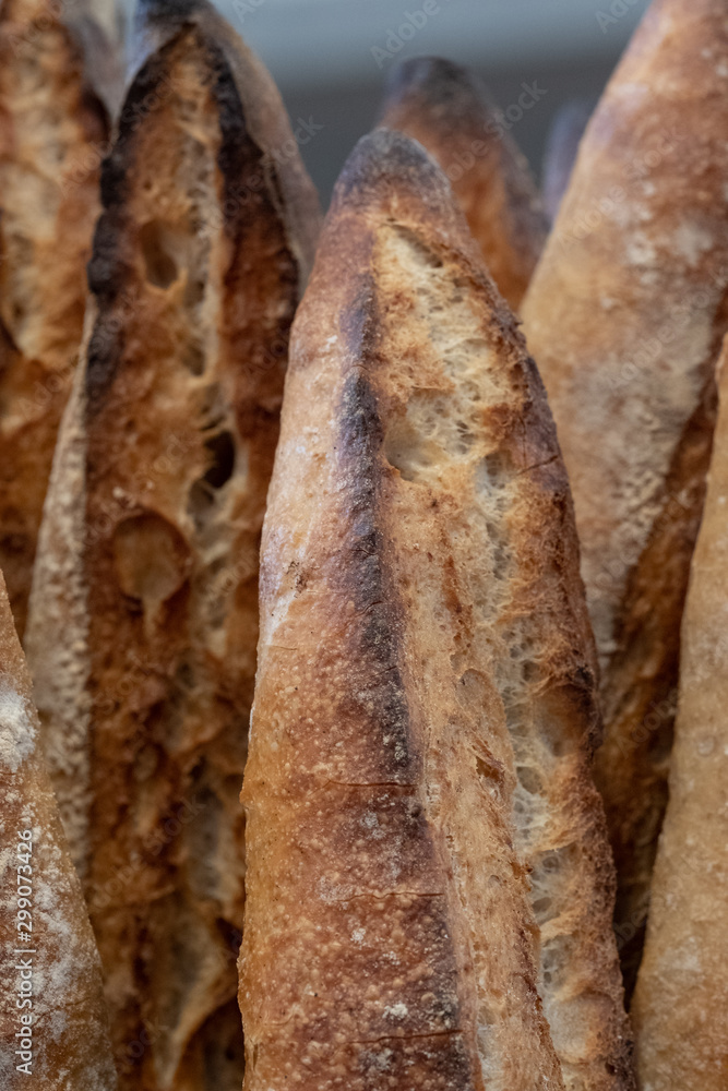 Close up of sour dough bread baguette loaves, photographed at a bakery near Bruton in Somerset, UK.
