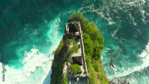 Bali, Indonesia, aerial view of Pura Luhur Uluwatu temple at sunrise. photo