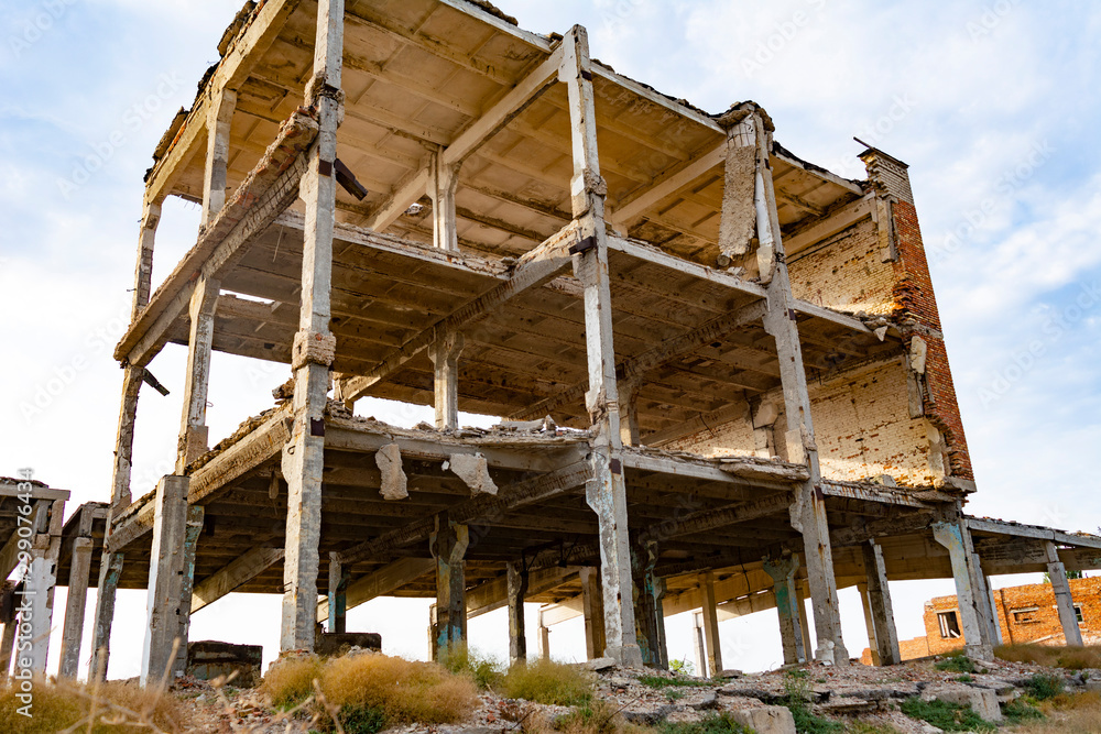 Obraz premium Old abandoned not finished building damaged by time.