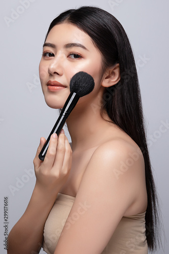 Beautiful young asian woman clean fresh bare skin concept. Asian girl beauty face skincare and health wellness, Facial treatment, Perfect skin, Natural make up. Isolated on gray background
