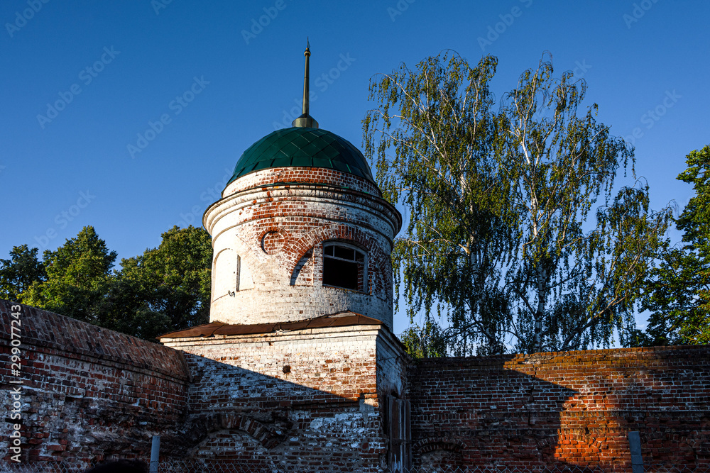 Russia, Vladimir Oblast, Golden Ring, Suzdal: Tower donjon and part of historic wall of famous old Saviour Monastery of Saint Euthymius from below with blue sky in one of the oldest Russian towns.