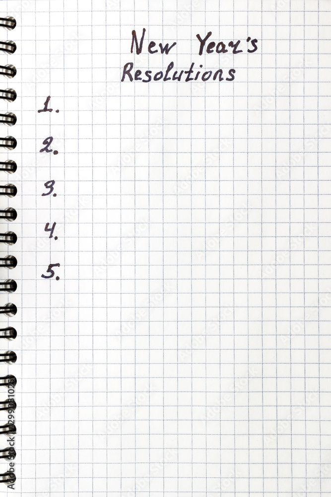 New Year's resolution, text on the paper in notepad, promises concept, top view New Year's resolution, text on the paper in notepad, promises concept, top view