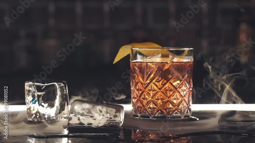 Cocktail with ice cubes on the bar