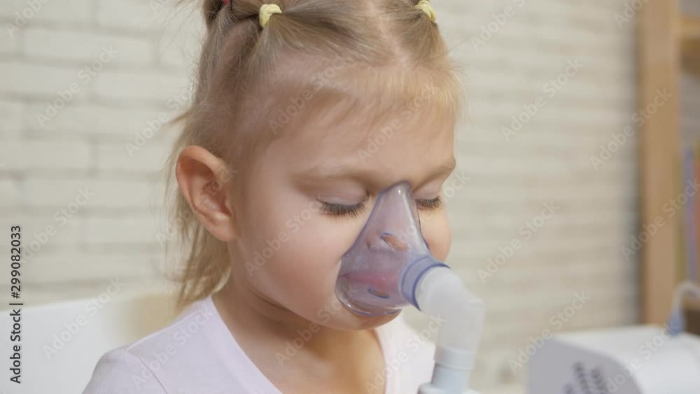 Little Girl Making Inhalation in Inhalation Mask. Little Girl Making Inhalation in Inhalation Mask.