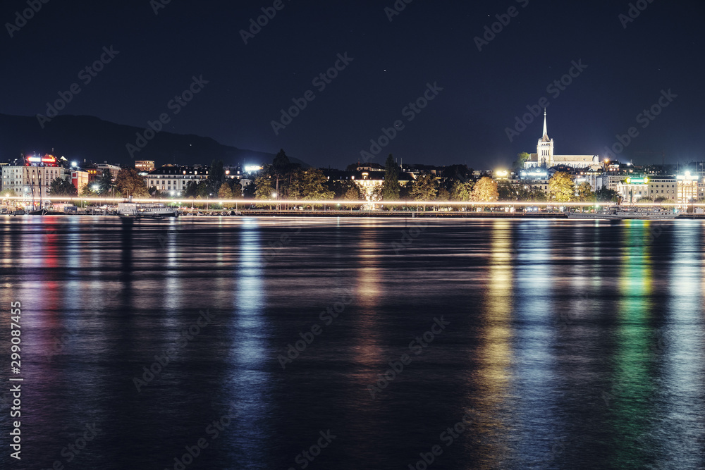 Views of the waterfront and St. Pierre Cathedral at night. Switzerland.