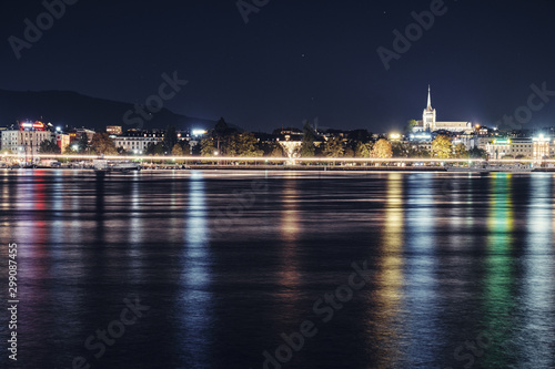 Views of the waterfront and St. Pierre Cathedral at night. Switzerland. © badahos