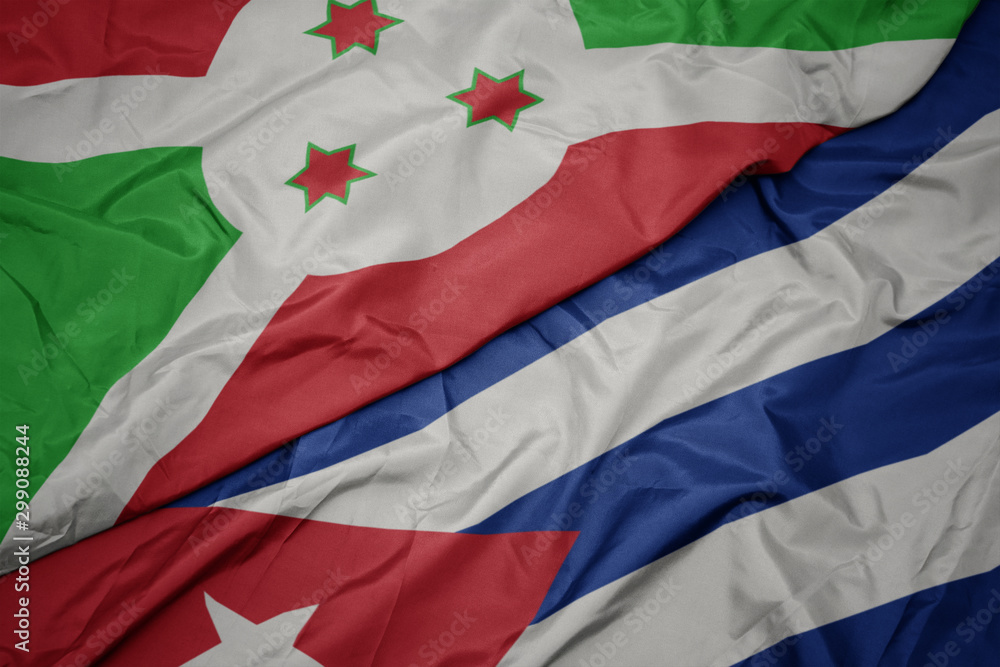 waving colorful flag of cuba and national flag of burundi .