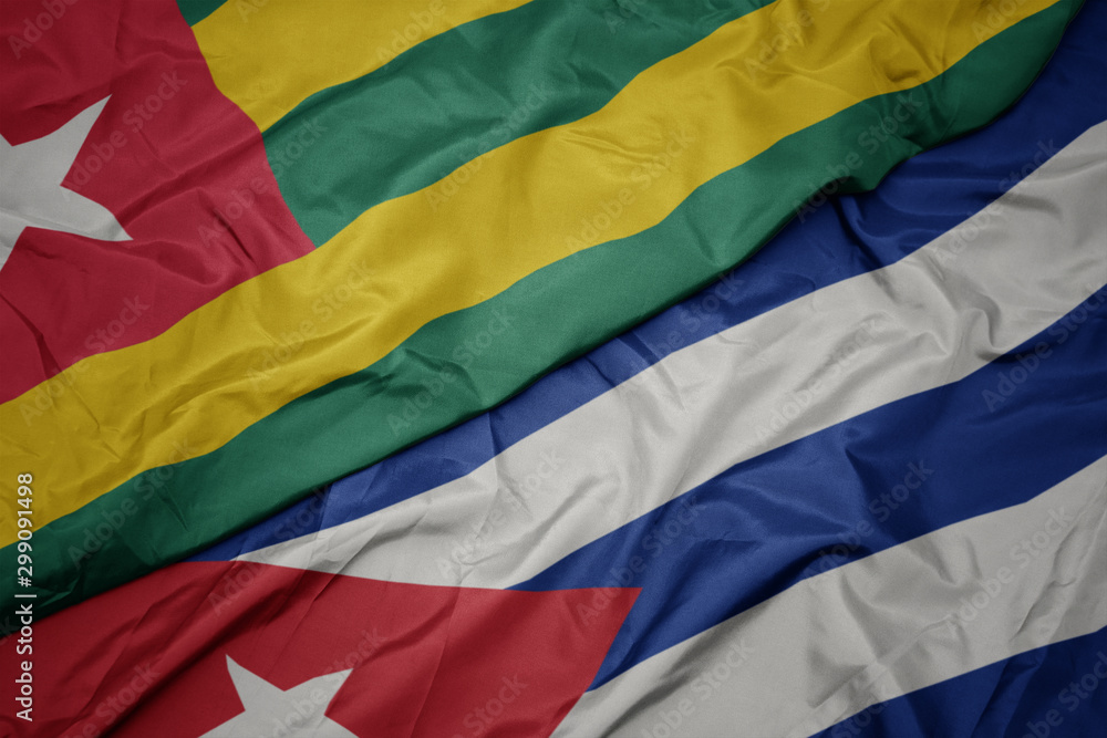 waving colorful flag of cuba and national flag of togo. waving colorful flag of cuba and national flag of togo.