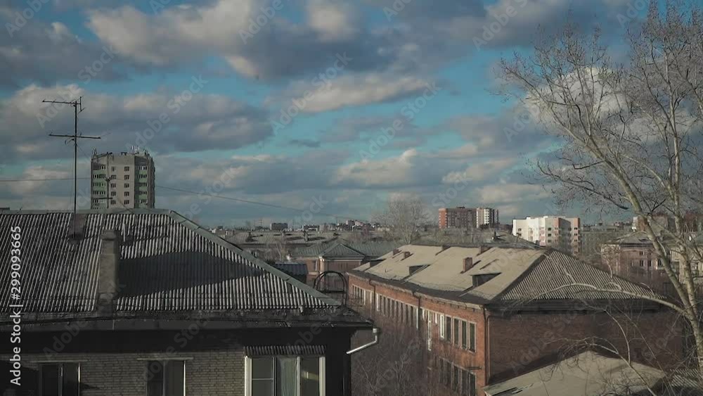 Timelapse. Sky with white clouds in Sunny autumn weather. View from the window of the sky and a small provincial town Timelapse. Sky with white clouds in Sunny autumn weather. View from the window of the sky and a small provincial town