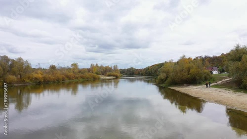 Aerial view of the Beautiful River Landscape at autumn. Moving camera forward subject. Cloudy day. photo