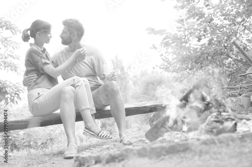 Tilt shot of romantic couple sitting at public park