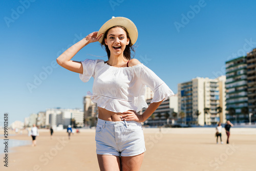 joyful girl on the beach exclaims in surprise © mnelen.com
