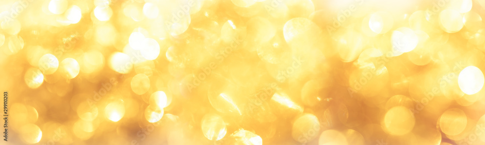 golden color blurred abstract background. yellow bokeh christmas blurred beautiful shiny Christmas lights. - obrazy, fototapety, plakaty 