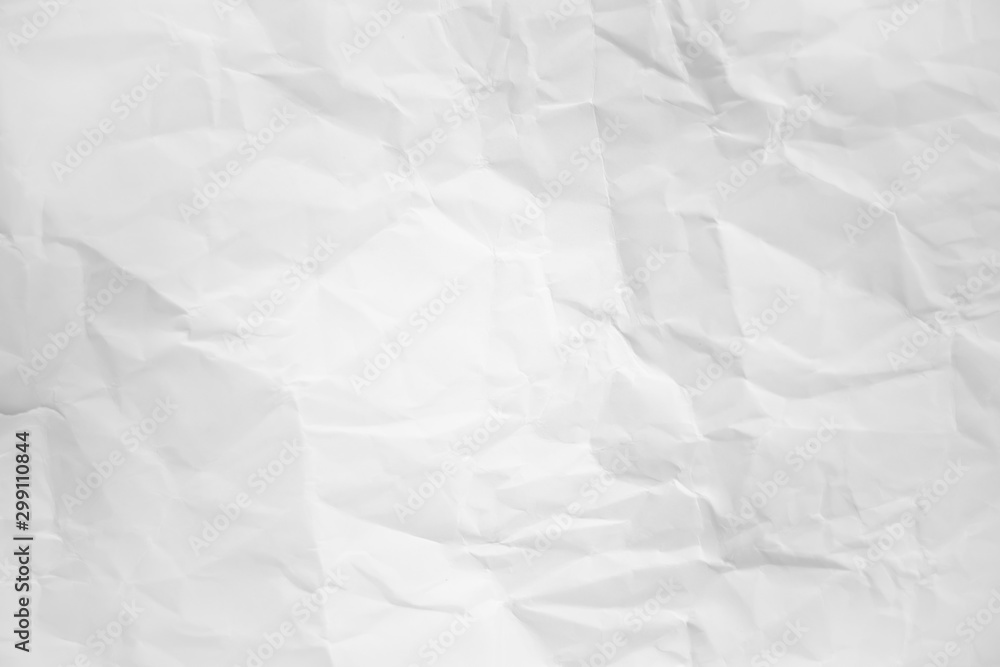 white and gray wide crumpled paper texture background. crush paper so that it becomes creased and wrinkled. white and gray wide crumpled paper texture background. crush paper so that it becomes creased and wrinkled.