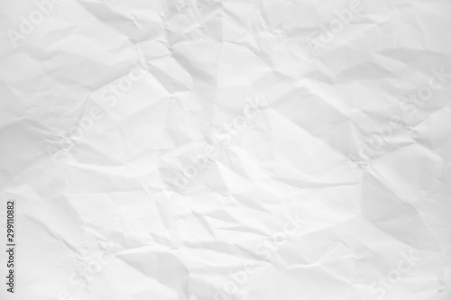 white and gray wide crumpled paper texture background. crush paper so that it becomes creased and wrinkled.