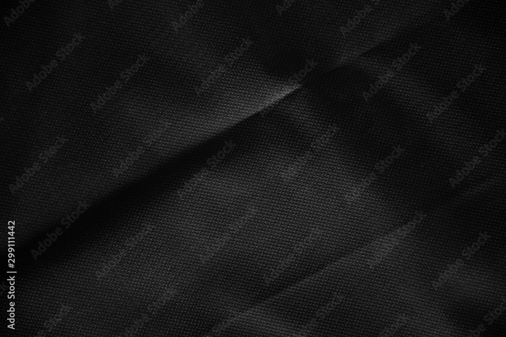 Obraz premium Black canvas pattern background. Surface with spotlight, dark tone.