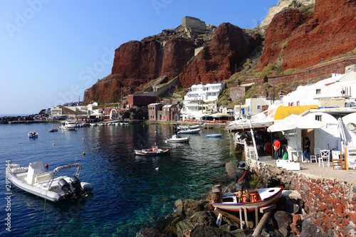 Photo from picturesque fishing harbour and bay of Ammoudi below iconic and famous village of Oia, Santorini island, Cyclades photo