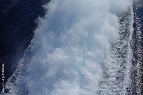Large white waves generated from high speed boat in deep blue Aegean sea and sky © aerial-drone