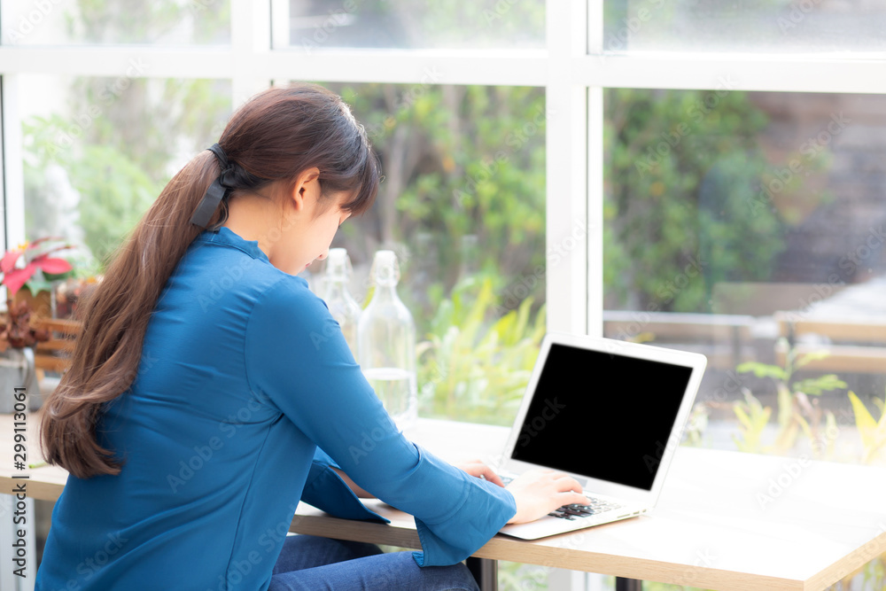 Beautiful portrait asia young woman working online on laptop sitting at cafe shop, professional female freelance using notebook computer, business and communication concept. Beautiful portrait asia young woman working online on laptop sitting at cafe shop, professional female freelance using notebook computer, business and communication concept.