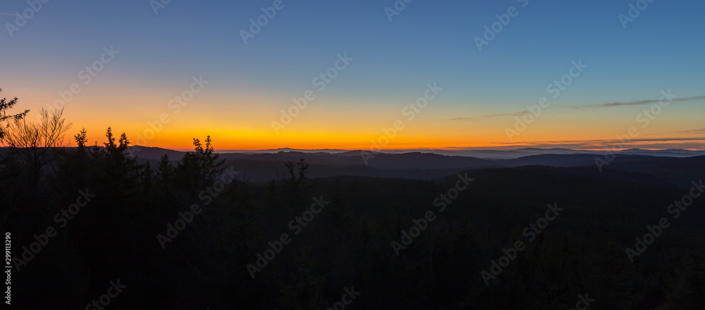 Obraz premium Panoramic view from lookout Nebelstein with distant hill, blue hour, Austria landscape