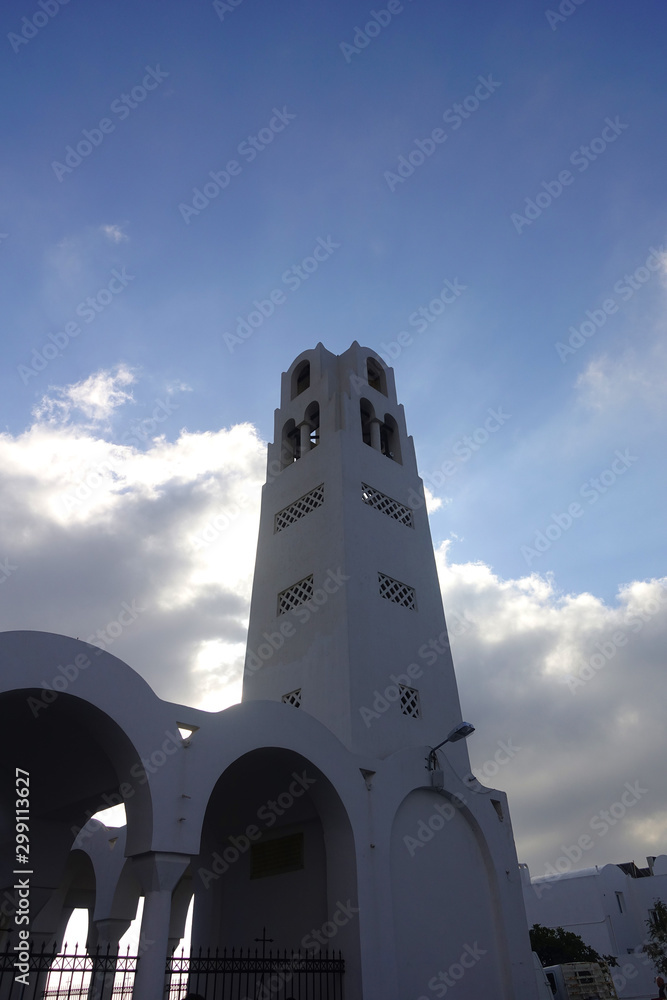 Fototapeta premium Picturesque landmark orthodox church of Ypapanti in beautiful village of Fira overlooking the caldera, Santorini island, Cyclades, Greece