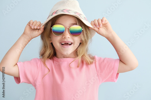 Stylish little girl on ligh...