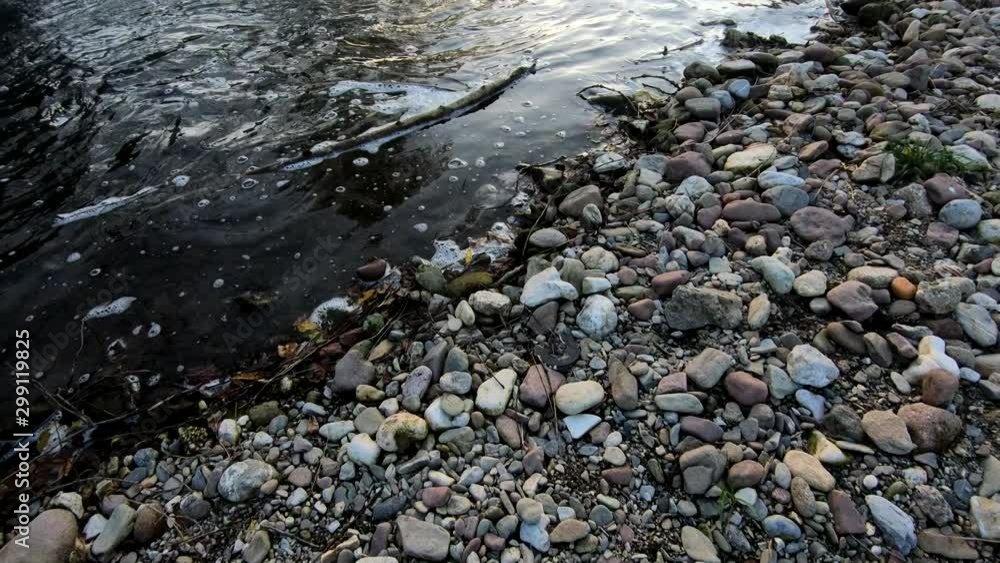 4K Slow motion forward moving tilt up river dam with flowing water at sunset 4K Slow motion forward moving tilt up river dam with flowing water at sunset