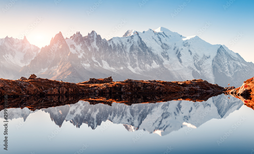 Incredible view of clear water and sky reflection on Chesery lake (Lac De Cheserys) in France Alps. Monte Bianco mountains range on background. Landscape photography, Chamonix. - obrazy, fototapety, plakaty 