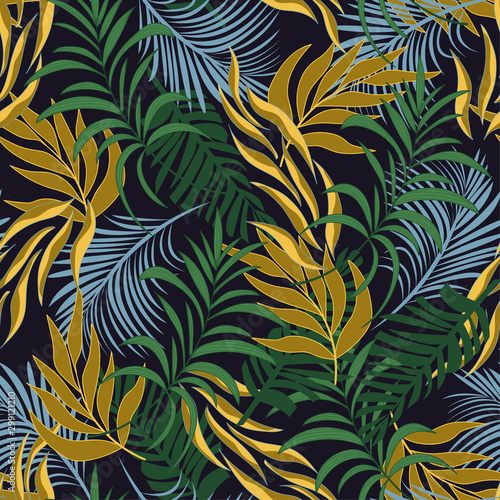 Original seamless tropical pattern with bright green and yellow plants and leaves on a dark background. Seamless pattern with colorful leaves and plants. Exotic tropics. Summer.
