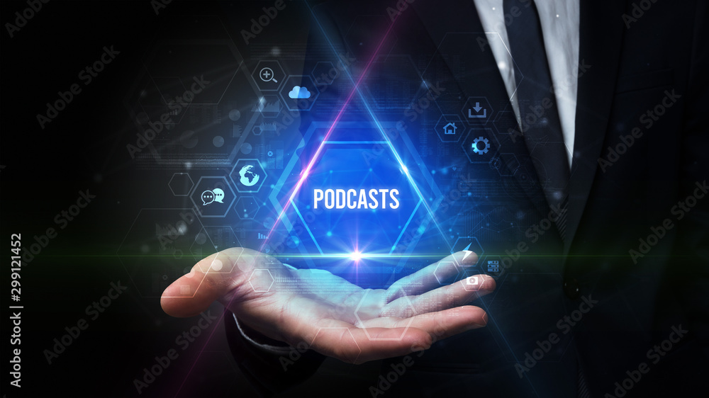 Obraz premium Man hand holding PODCASTS inscription, social media concept