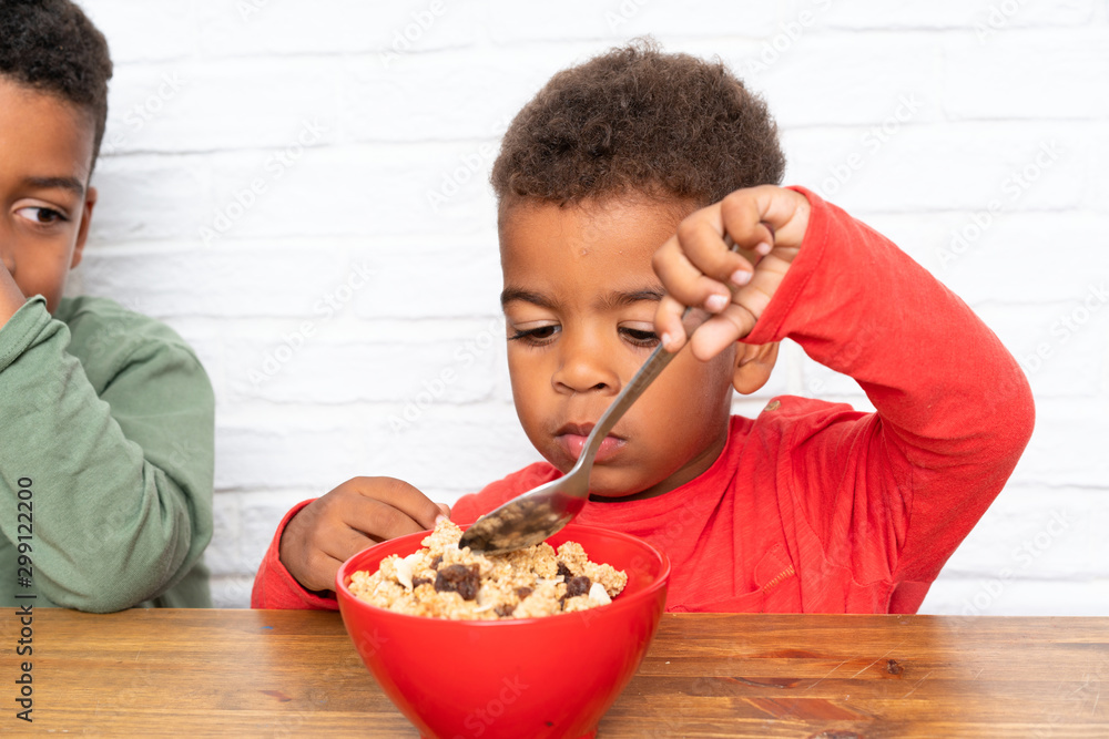 African American brothers having breakfast African American brothers having breakfast