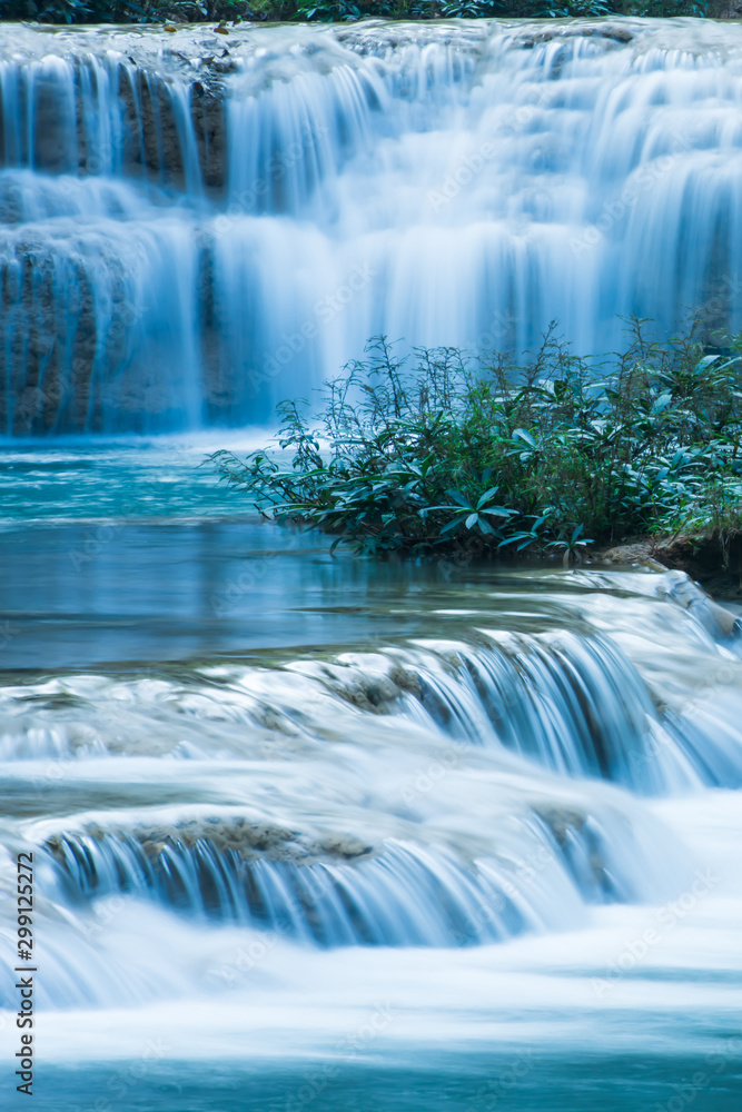 Relaxing by tropical waterfall in the morning.