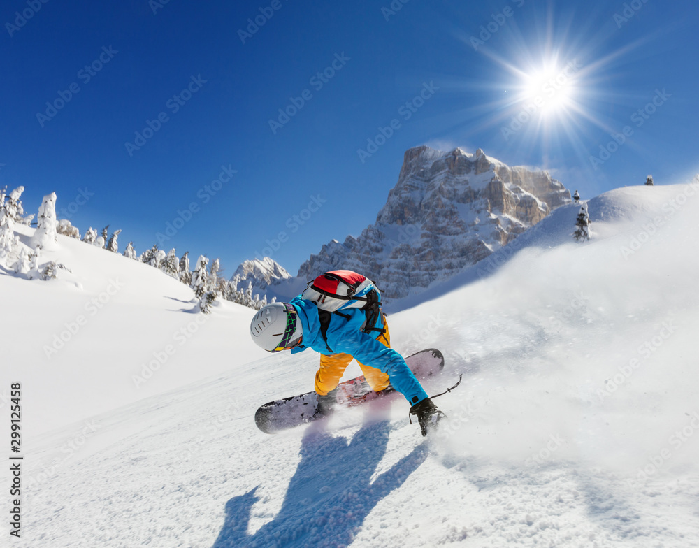 Snowboarder running downhill