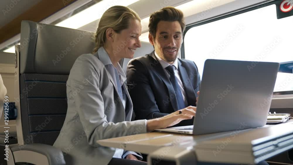 two colleagues working on a train two colleagues working on a train