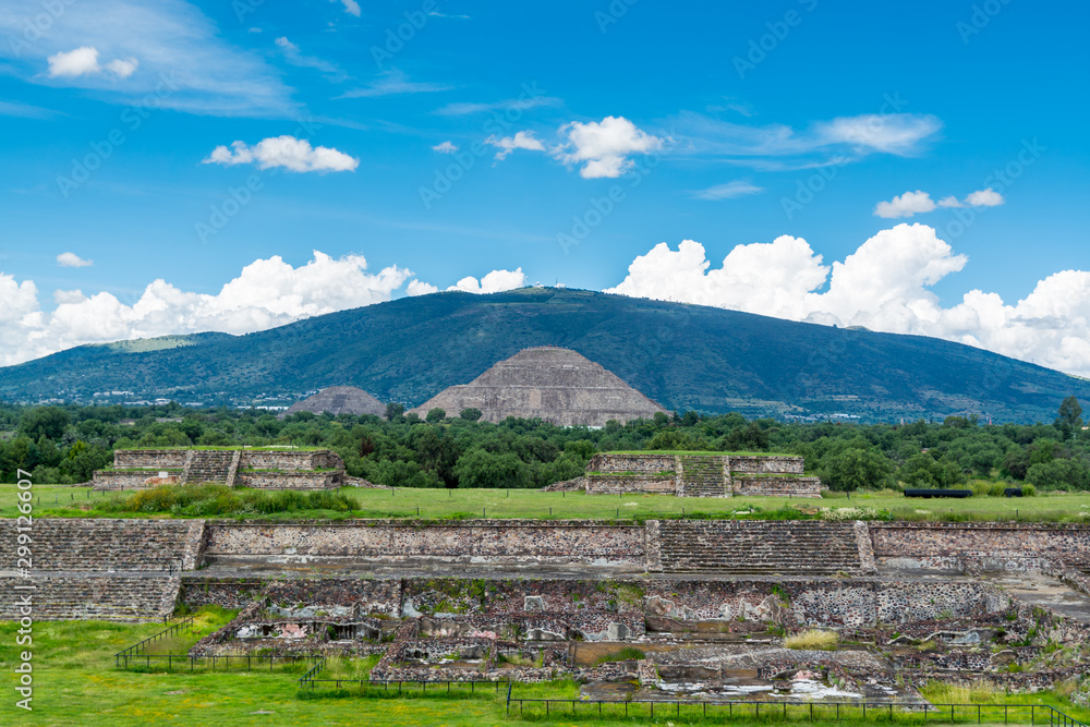 Ruins of the architecturally Mesoamerican pyramids with  Pyramid of the Sun, the largest building in Teotihuacan, an ancient Mesoamerican city located in a sub-valley of the Valley of Mexico