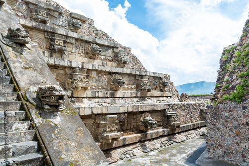 Architectural details with dragon head sink drain of  Mesoamerican pyramids and green grassland located at at Teotihuacan, an ancient Mesoamerican city located in a sub-valley of the Valley of Mexico
