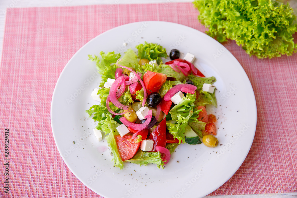 Tasty fresh Greek salad on white wooden table, Tasty fresh Greek salad on white wooden table,