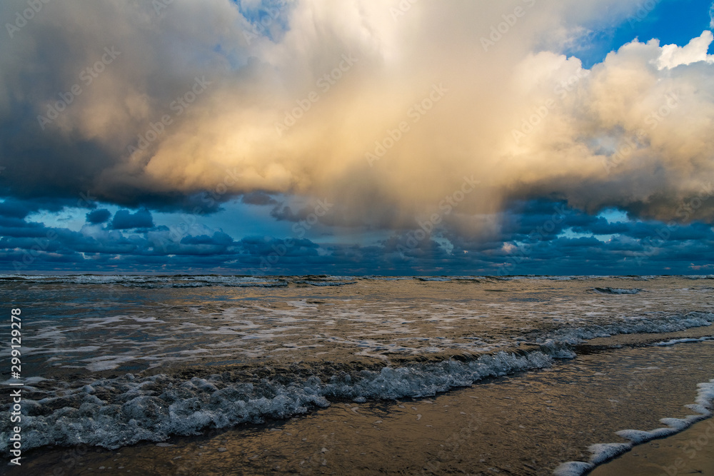 Big clouds over Baltic sea in autumn morning.