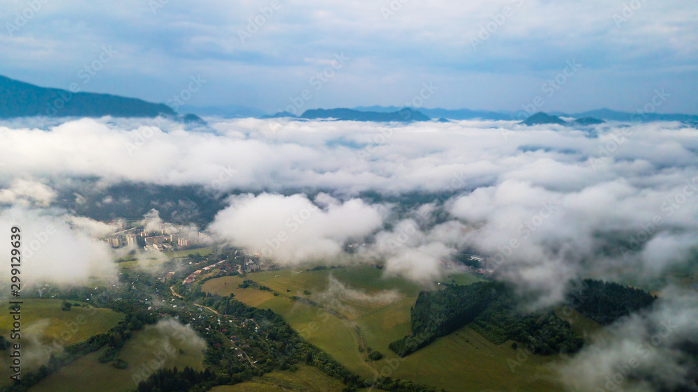 Aerial view through clouds to the city of Dolny Kubin Aerial view through clouds to the city of Dolny Kubin