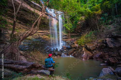 The girl in blue  sweater touring on Yung Thong waterfall, Beautiful waterfall in Udonthani province, ThaiLand. photo