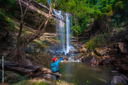 The girl in blue  sweater touring on Yung Thong waterfall, Beautiful waterfall in Udonthani province, ThaiLand. photo