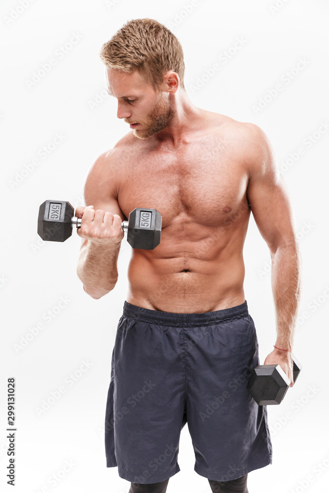 Confident attractive young muscular sportsman standing