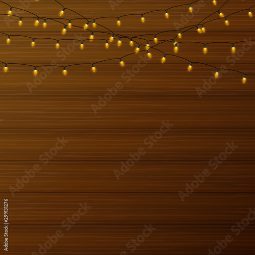 Realistic lantern garland on wood background. Vector stock illustration