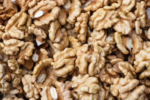 Closeup of big shelled walnuts pile.