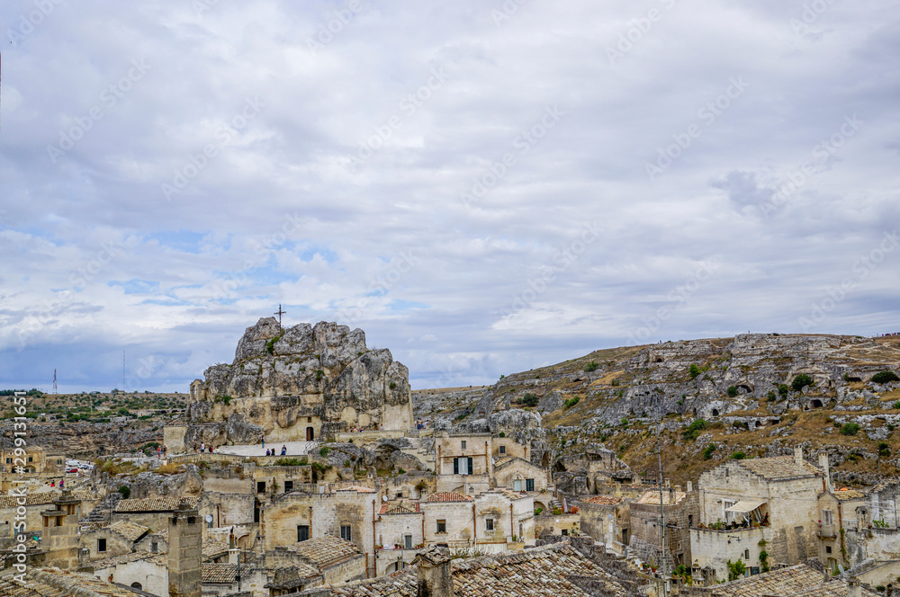 01_A look at the characteristic cliff and the cave church Madonna de Idris, Matera, Italy.